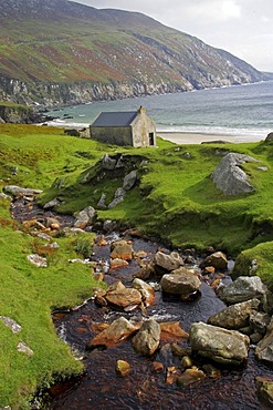 Stone cottage on coast near Keel, Achill Island, County Mayo, Ireland