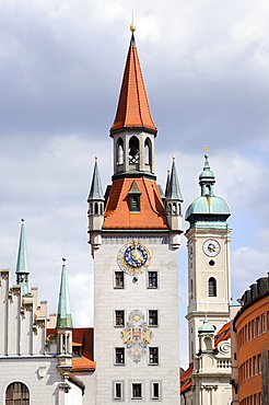 The old town hall tower with the bell tower of the Heilig-Geist-Kirche Holy Spirit Church on the Marienplatz square in Munich, Bavaria, Germany, Europe