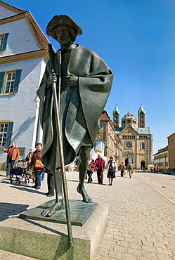 Speyer pilgrim, on their way to Compostela, bronze statue by Martin Mayer, in the back the the Speyer Cathedral, Speyer, Rhineland-Palatinate, Germany, Europe.