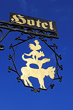 Hotel sign "The Bremen Town Musicians" at Hotel Bremer Hof against blue sky, Lueneburg, Lower Saxony, Germany, Europe