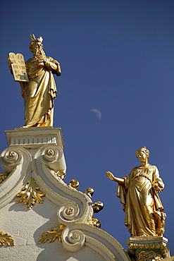 Golden statues on the roof of the city hall in the historic centre of Bruges, Belgium, Europe