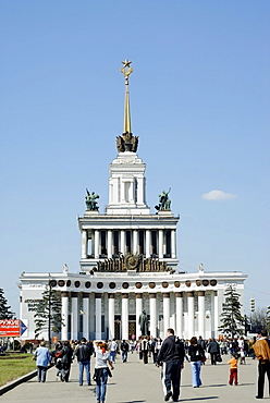 Moscow VVTs or VDNKh, All Russian Exhibition Centre, central pavilion, and many people on a sunny week-end day, Moscow, Russia