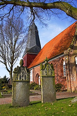 Old gravestones in front of the St. Nicolai-Kirche church in Beidenfleth, district Steinburg, Schleswig-Holstein, Germany,