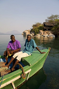 Staff on a boat, Mumbo Island Camp, Cape Maclear Peninsula, Lake Malawi, Malawi, South East Africa