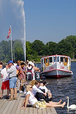 People on the Alster Lake steamer quay in Hamburg, Germany, Europe