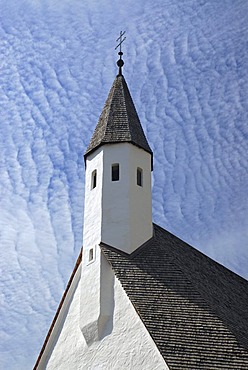 The tower of a small chapel against thin high clouds in Bad Ausee, Styria, Austria, Europe