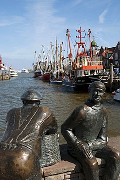 Sculpture old and young fishermen, fishing boats, harbour, Neuharlingersiel, East Frisia, Lower Saxony, Germany, Europe