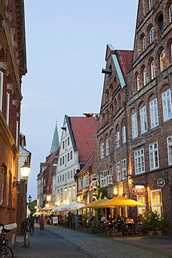 Heiligengeist street with Krone guesthouse at dusk, historic town centre, Lueneburg, Lower Saxony, Germany, Europe