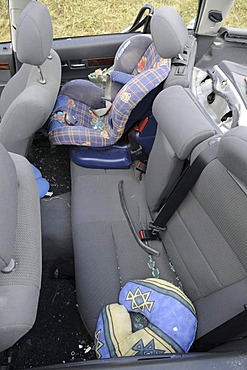 Back seat, child car seat, in accident damaged car