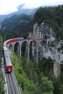 RhB, Rhaetian Railway train crossing the Landwasser Viaduct near Filisur, Albula section, Filisur, Graubuenden, Switzerland, Europe