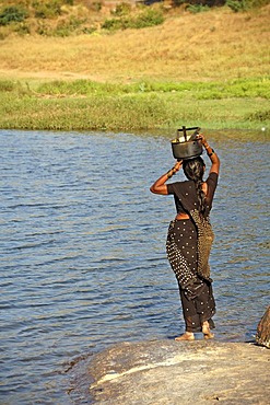 Indian woman fetching water, Hampi, Karnataka, India, South Asia