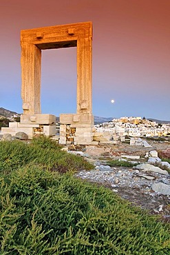 Ancient gateway, Portara of the Apollon Temple, an attraction of the city of Naxos, Cyclades, Greece, Europe