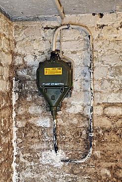 House connection, current 330 V with fuse panel 63 A in a house cellar before renovation, damp walls, Germany, Europe