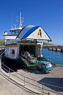 Ferry from Malta docking in the Mgarr port of Gozo and unloading vehicles, Mgarr, Gozo, Malta, Europe