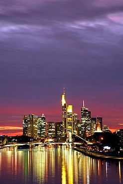 Skyline just after sunset with offices and high rise in the banking district, pink sky with grey clouds over Frankfurt am Main, Hessen, Germany, Europe