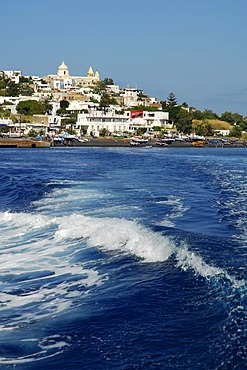 Waves in front of a white village on Stromboli Island, Aeolian or Lipari Islands, Tyrrhenian Sea, Sicily, South Italy, Italy, Europe