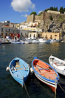 Small fishing boats in the port of Marina Corta in front of the castle hill in the city of Lipari on Lipari Island, Aeolian or Lipari Islands, Tyrrhenian Sea, South Italy, Italy, Europe