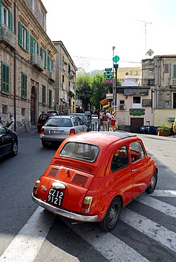 Red Fiat 500 in the historic centre of Tropea, Vibo Valentia, Calabria, South Italy, Europe