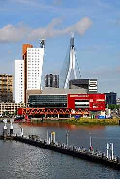 Modern architecture by the waterside: the red Luxor theatre, to the left of it the Belvedere building of the telephone company KPN Telecom and behind it the Erasmusbrug bridge, Wilhelminapier, Wilhelminaplein, Rijnhaven, Rotterdam, South Holland, the Neth