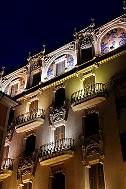 Illuminated facade with balconies and art nouveau elements on the Placa Weyler, Plaza Weyler, in the evening, former Gran Hotel from approx. 1902, today cultural center of the Fundacio La Caixa, Palma de Mallorca, Mallorca, Balearic Islands, Spain, Europe