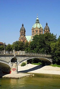 Kabelsteg Bridge crossing the Isar River, Praterinsel Island, in the back the towers and cupola of the St. Lukas Church, Munich, Upper Bavaria, Germany, Europe