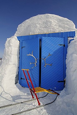 Entry doors to the igloo-hotel with caribou-antlers and sledge, Snow Hotel, Kirkenes, Finnmark, Lapland, Norway, Scandinavia, Europe