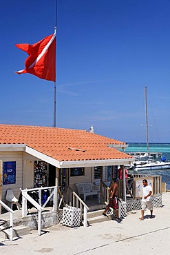 Diving flag over the scuba diving center at the Sun Breeze Hotel, San Pedro, Ambergris Cay Island, Belize, Central America, Caribbean