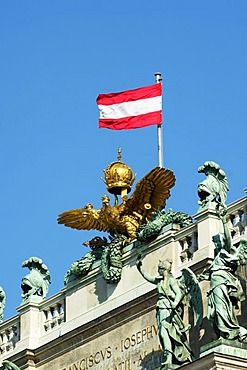 Imperial double-headed eagle with the Austrian flag on the roof of the National Library, Hofburg, Vienna, Austria, Europe