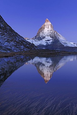 Matterhorn reflection in Riffelsee, Zermatt, Wallis, Switzerland, Europe