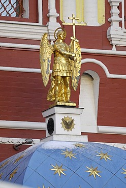 Sculpture of the golden angel holding a cross on top of the dome near Krasnaya Square, Red Square, Moscow, Russia