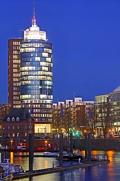 Illuminated tower of Hanseatic Trade Center HTC at night, HafenCity, Speicherstadt, old warehouse district, Kehrwiederspitze, port of Hamburg, Germany, Europe