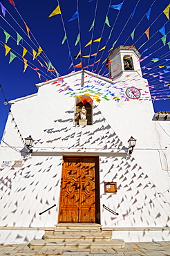 Small colourful flags outside Santa Ana Church during fiesta, Altea la Vella, Alicante, Costa Blanca, Spain