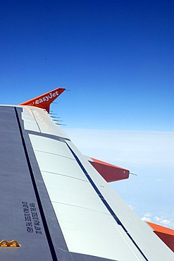 Wing of an easyjet airplane during the flight, travel