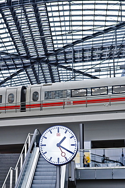 Station clock and ICE train, main station, Berlin, Germany