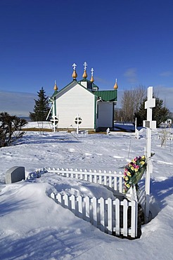 Russian-orthodox church with cemetery in winter in Ninilchik, Kenai Peninsula, Alaska, USA, North America