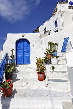 House entrance with a door painted in greek blue, Thira, Santorini, Greece