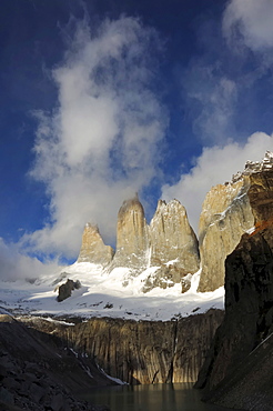 Three rock towers in the clouds, Torres del Paine National Park, Patagonia, Chile (Torres del Peine)