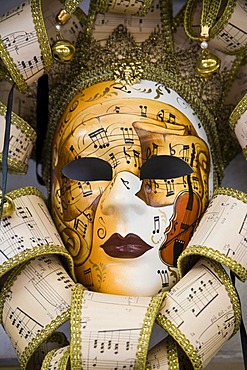 Venetian mask with notes and music motif, Venice, Veneto, Italy, Europe