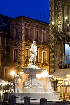 Fountain illuminated at night, Piazza del Duomo, Catania, Sicily, Italy