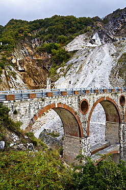 Stone bridge in the marble stone pit of Carrara Tuscany Italy