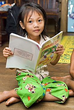 Portrait of a girl with school book, Koh Kong Province, Cambodia