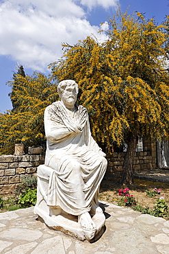 Statue of philosopher in front of the museum in Gortys. Crete, Greece, Europe