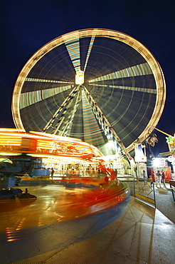 Giant wheel and carousel by night, funfair, Waldkraiburger Dult, Waldkraiburg, Upper Bavaria, Bavaria, Germany