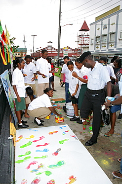 Colourful footprints to symbolize diverse ethnic backgrounds, protesting violence against women, in Georgetown, Guyana, South America