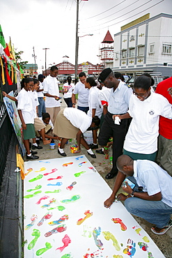 Colourful footprints to symbolize diverse ethnic backgrounds, protesting violence against women, in Georgetown, Guyana, South America