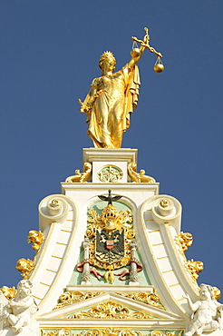 Statue of Justice with scales and sword on the gable of the courthouse in Bruges, Flanders, Belgium, Europe