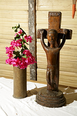 Crucifix, traditionally carved wooden figure of Christ on an altar, Mindre village, Papua New Guinea, Melanesia