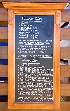 Menu outside a restaurant in Armacao de Pera, Algarve, Portugal, Europe