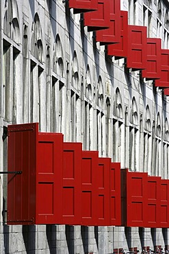 Building in the old part of town, with many red window blinds, Utrecht, Netherlands