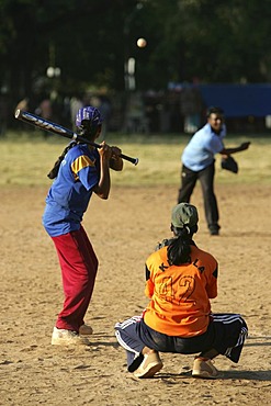 Young women playing baseball, Cochin, Kerala, India